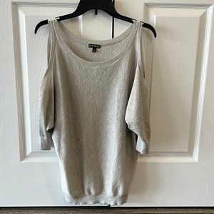 Open shoulder with 3/4 length sleeves which are banded together at the bottom.